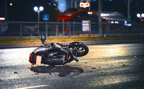 Image is of a crashed motorcycle laying on its side concept of motorcycle accident injury treatment in Chicago