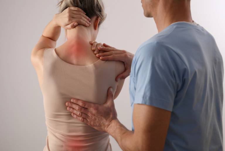 Image is of a female patient with pain in her neck and lower back while doctor is examining her, concept of role of pain management in personal injury cases